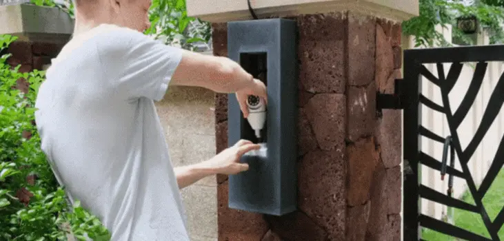 guy installs SafeCam360 in garden